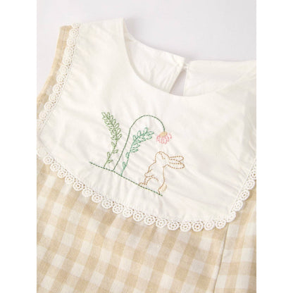 girls Easter bunny embroidered gingham dress, vintage style, beige, neutral colors, aesthetic, hanging on hanger on a neutral background, flowy skirt design on dress, close up of embroidered bunny and lace trim