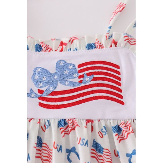 Children's dress with American flag design on a white background