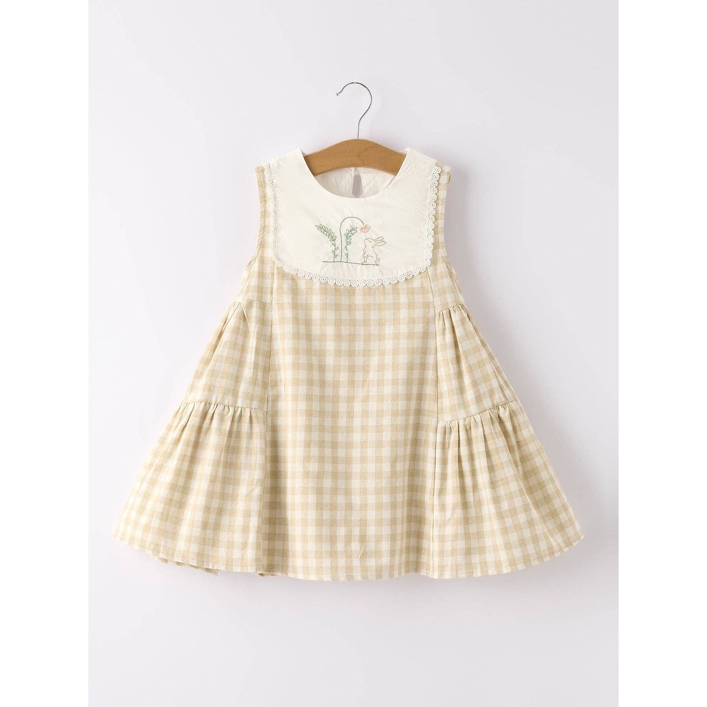 girls Easter bunny embroidered gingham dress, vintage style, beige, neutral colors, aesthetic, hanging on hanger on a neutral background, flowy skirt design on dress