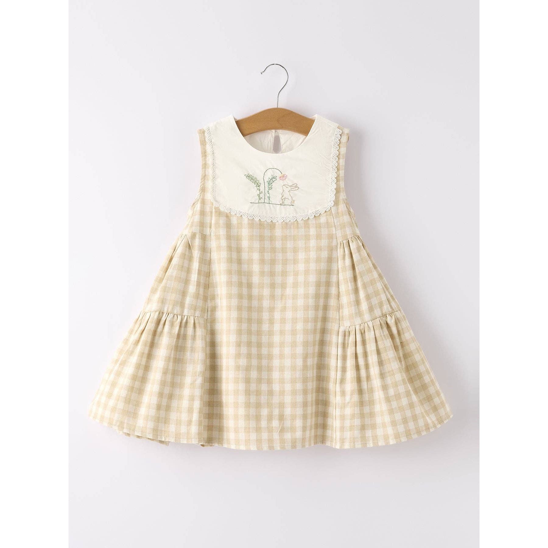 girls Easter bunny embroidered gingham dress, vintage style, beige, neutral colors, aesthetic, hanging on hanger on a neutral background, flowy skirt design on dress