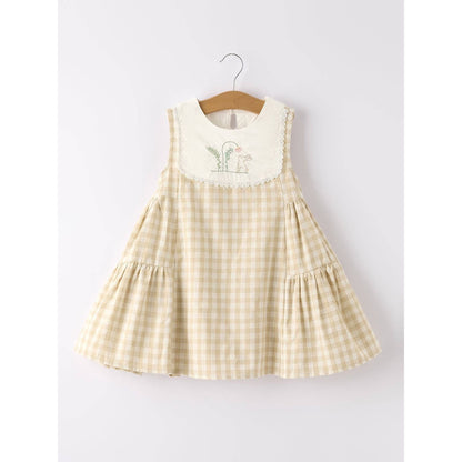 girls Easter bunny embroidered gingham dress, vintage style, beige, neutral colors, aesthetic, hanging on hanger on a neutral background, flowy skirt design on dress